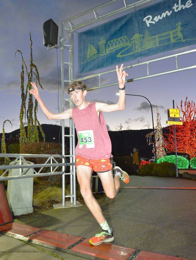 Photo by Matt Sagan, Cascadia Films/ Dustin Hines of Port Townsend won the Jamestown Glow Run 5K, a year after finishing second in the same race. John Mauro, also of Port Townsend, won the 10K.