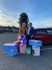 Photo courtesy Linda Klinefelter
The Sequim Food Bank made a request of Soroptimist International of Sequim to assist with providing larger size diapers and the groups membership stepped up and provided 14 cases of diapers in sizes 4-6 earlier this month. Linda Klinefelter, president of SIS, on right, presented Andra Smith, executive director of the Sequim Food Bank, with the donation.