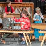 Sequim Gazette photo by Emily Matthiessen/ Five Acre students exchange a high-five on the successful completion of their marimba songs during their Winter Concert held at Peninsula College last Friday. The non-profit elementary school is celebrating their 30th anniversary and is in the midst of a fundraiser for their tuition assistance program.