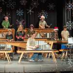 Sequim Gazette photo by Emily Matthiessen
Five Acre School, a local non-profit elementary school, held their Winter Concert last Friday at Peninsula College under handmade decorative wooden snowflakes. The Old Hands Sound Waves after school group performs under the direction of Rosie Sharpe on the drums: back row, Miles Taylor, Spencer Armstrong, next row, Cascadia Cammett and Hero Gaede, next row, Ailo Saari, Hoko Saari, Alex Amirsadeghi, Soren Albright, front row, June VanDenburg and Elliana Ristick.
