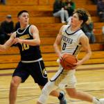 Sequim Gazette photo by Matthew Nash/ Ethan Melnick goes up for a shot on Dec. 13. He scored five points and snagged eight rebounds against Bainbridge.