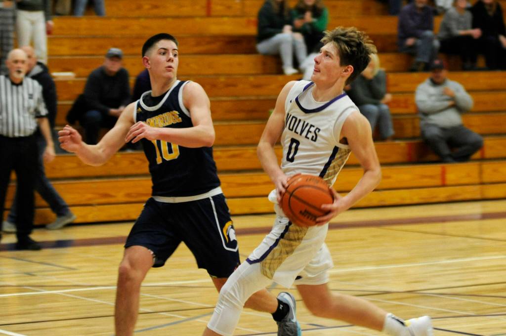 Sequim Gazette photo by Matthew Nash/ Ethan Melnick goes up for a shot on Dec. 13. He scored five points and snagged eight rebounds against Bainbridge.