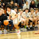 Sequim Gazette photo by Matthew Nash
Jericho Julmist makes one of his two steals against Bainbridge on Dec. 13.