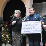 Sequim Gazette photo by Matthew Nash
Sequim-Dungeness Hospital Guild president Deborah Carlson presents a $10,000 ceremonial check to community paramedic Mark Karjalainen with Clallam County Fire District 3 for an ultrasound machine in his vehicle, and to pay for his training on the device. Pictured are Capt. Kolby Konopaski, left, and Fire Chief Justin Grider.