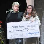 Sequim Gazette photo by Matthew Nash/ Lisa Palermo, development director for Volunteer Hospice of Clallam County, accepts a $10,000 check from Sequim-Dungeness Hospital Guild president Deborah Carlson to purchase new mattresses, hospital beds, and other needed medical supplies.