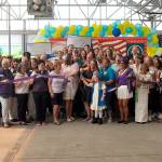 Sequim Gazette photo by Matthew Nash Donna Staus and her granddaughter Jordyn Mancuso-Staus cut the ribbon for the Sequim-Dungeness Valley Chamber of Commerce during a ceremony recognizing the finished remodel of the Sequim Walmart. The ceremony also recognized Staus husband Lynie who passed away in May, and worked for Walmart for nearly 24 years.