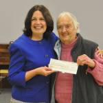 Sequim Gazette photo by Matthew Nash/ Marylaura Ramponi originally pledged $1 million in July for naming rights for the Ramponi Center for Technical Excellence, a vocational building at Sequim High School. Here she donates a $500,000 check on Oct. 17 to Sequim School District superintendent Regan Nickels The check was made in honor of Marylauras husband Louie, as it would have been his 89th birthday. She plans to give another $500,000 on her birthday in March.