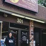 Sequim Gazette photo by Elijah Sussman / New owner Carly Rasmussen stands in front of The Oasis Bar and Grill in Sequim on May 3.