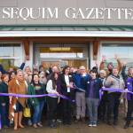 Photo by Time Catcher Photography Past and present staffers along with local business and community members celebrate the Sequim Gazettes 50th anniversary on Nov. 20 at the newspapers new office space, 175 W. Washington St., Sequim. Regional publisher Eran Kennedy with Sound Publishing had the honors of cutting the ribbon for the Sequim-Dungeness Valley Chamber of Commerce.