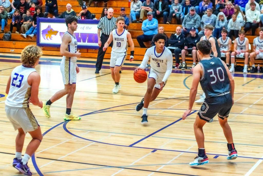 Sequim Gazette photo by Emily Matthiessen
Solomon Sheppard drives against W.F. West on Dec. 28.