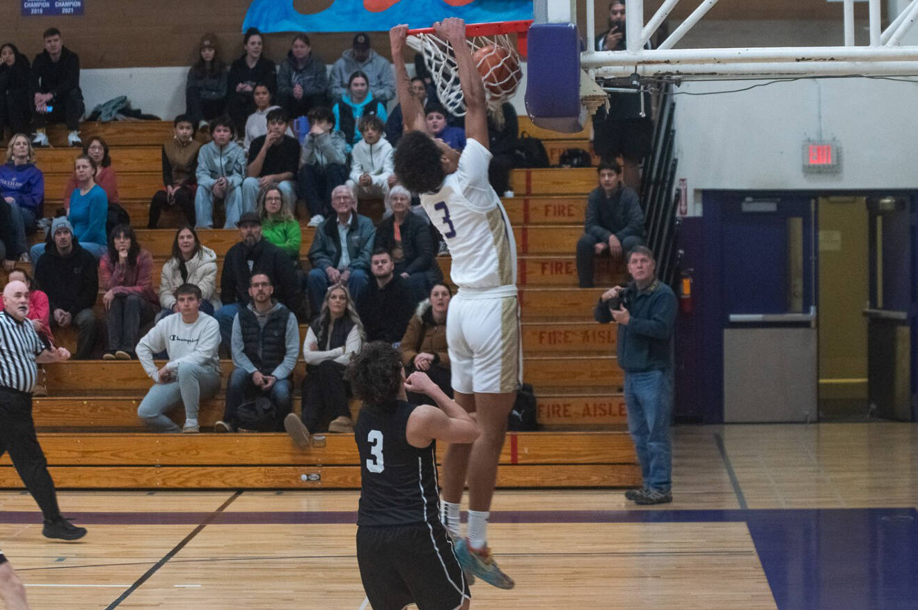 Sequim Gazette photo by Emily Matthiessen
Sequims Solomon Sheppard dunks against North Kitsap on Jan. 10 during a 74-46 victory to remain unbeaten on the season.