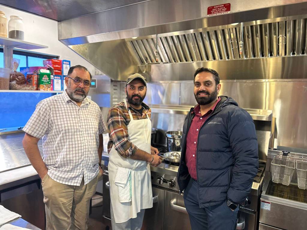 Sequim Gazette photo by Kathy Cruz 
From left, Hardys Market co-owner Harvir Sangha, chef DP Singh and co-owner Harinderbir Nagra stand in the stores new kitchen just minutes before launching their new Indian menu items.