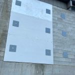 Sequim Gazette photo by Matthew Nash
This plywood sheet was placed on the Transportation Centers repair shops north side wall a few years ago to prevent it from deteriorating more. However, Sequim School District staff said the wall continues to crack and there is a growing gap between the wall and floor due to water infiltration underneath the building.