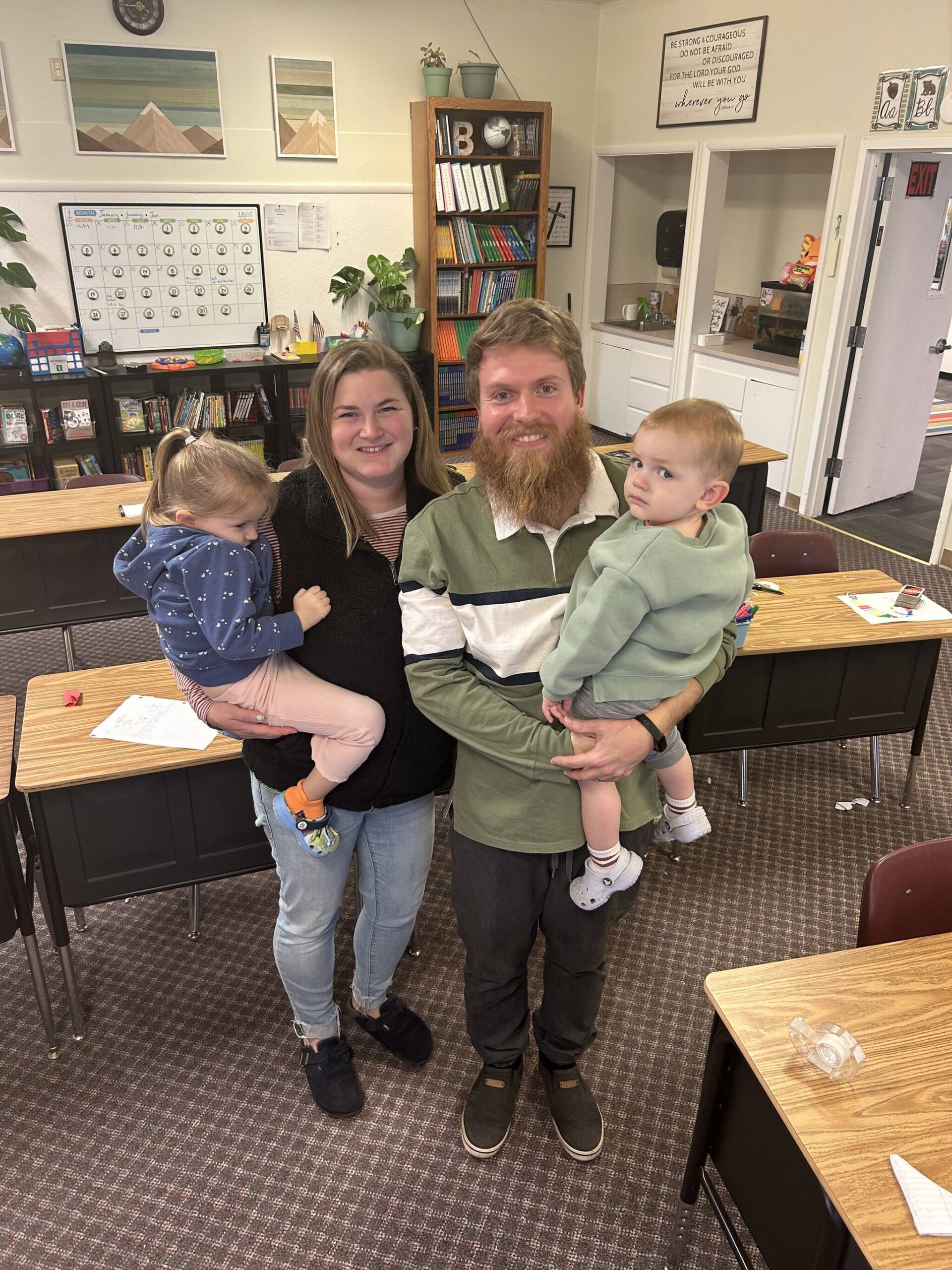 Sequim Gazette photo by Kathy Cruz
Josh Bonifant is visited at Peninsula Adventist Elementary School, where he is principal and teacher for grades 3-8, by his wife Mallory and their children Isla, 4, left, and Henry, 2. A native of Bonney Lake in Pierce County, Bonifant is teaching in the same classroom where his wife was once a student.