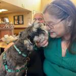 Sequim Gazette photo by Kathy Cruz
Resident Teresa Huffman enjoys affection from therapy dog Jazmine. She said the pooch helps alleviate the pain of missing her black lab retriever mix, Hank.