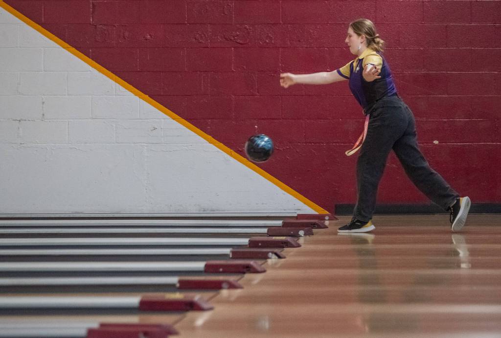 Sequim Gazette photo by Emily Matthiessen/ Kiera Morey bowls for the Wolves last regular game on Thursday at Laurel Lanes in Port Angeles.