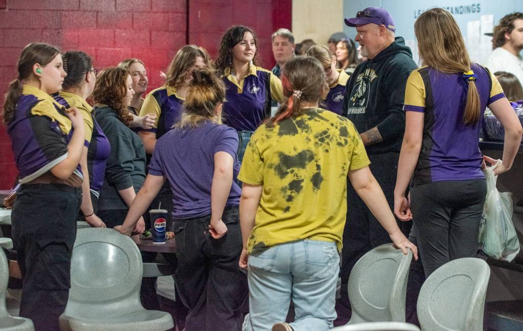 Sequim Gazette photo by Emily Matthiessen
Sequims bowling team clusters around coach Randy Perry after their last regular game of the season. They head to the league tournament on Friday.