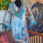 Sequim Gazette photo by Emily Matthiessen
Armstrongs work includes large pieces attached to canvas, like the wave shown here, and clothing made from eco-dying, nuno-felting and silk roses.