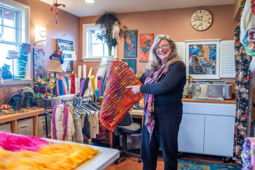 Sequim Gazette photo by Emily Matthiessen
In her wet felting studio, Sequim artist Lora Armstrong explains how ruching happens in nuno felt work.