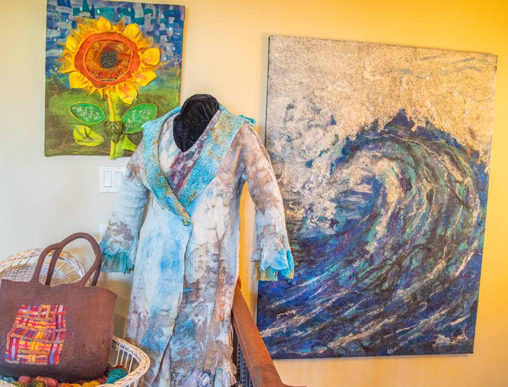 Sequim Gazette photo by Emily Matthiessen
Felter Lora Armstrongs pieces are varied. They include giant pieces attached to canvas, like the wave shown here, and clothing pieces that involve the intricacies of eco-dying, nuno-felting and silk roses.