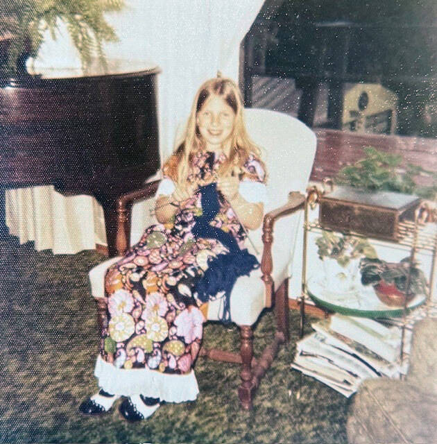 Photo courtesy of Lora Armstrong/ A young Armstrong, who learned to knit when she was about 5, knits a belt while sitting in her grandmothers rocker. Ive always been a very tactile person. Ive always loved color, she said.