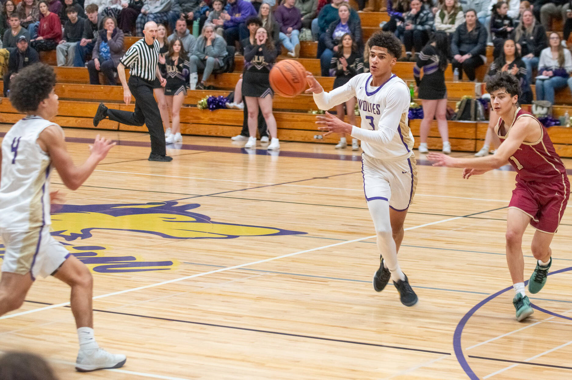 Sequim Gazette photo by Emily Mathiessen
Solomon Sheppard makes a pass to teammate Jericho Julmist during Sequims big 68-40 win at home against Kingston on Jan. 17.