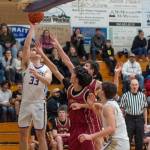 Sequim Gazette photo by Emily Mathiessen
Jamison Gray goes up for a shot over Kingston players on Jan. 17. He scored 10 points in the 68-40 win.