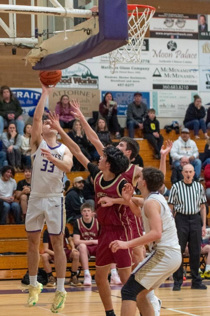Sequim Gazette photo by Emily Mathiessen
Jamison Gray goes up for a shot over Kingston players on Jan. 17. He scored 10 points in the 68-40 win.