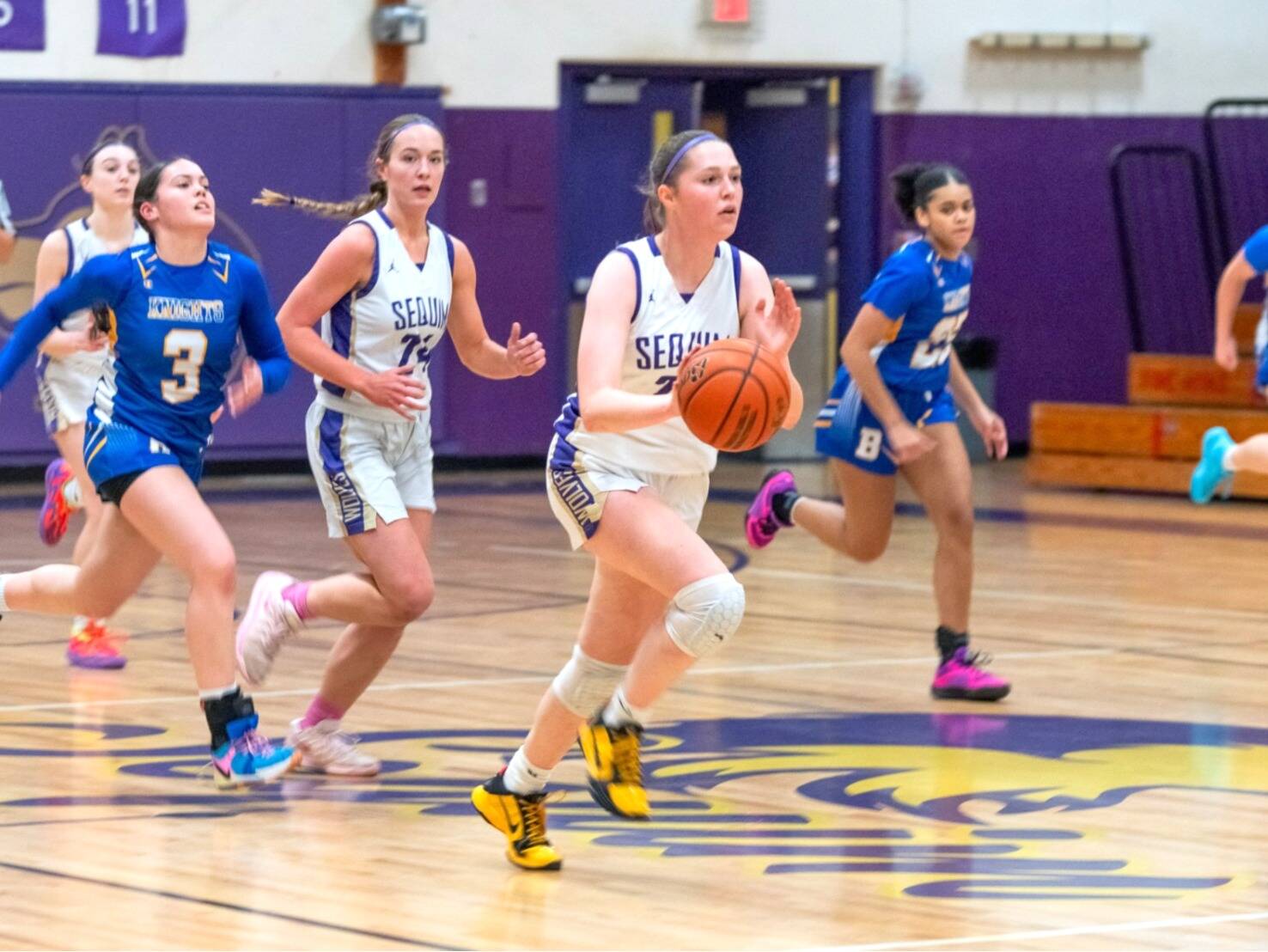 Sequim Gazette photo by Emily Matthiessen/ Libby Turella brings the ball up court against Bremerton on Jan. 14.