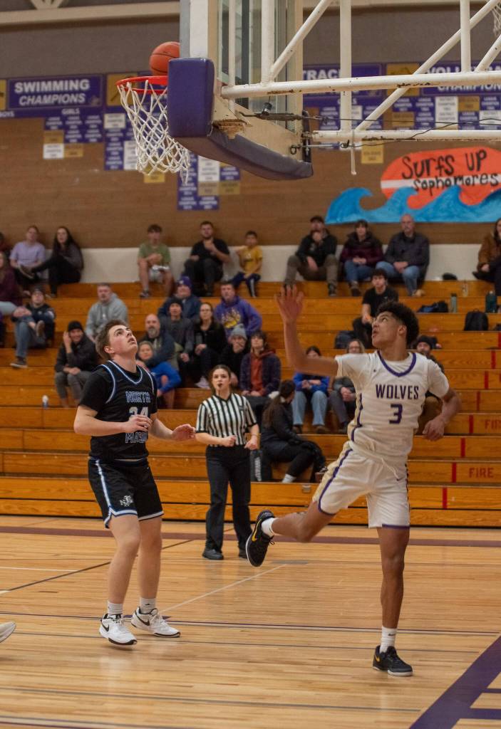 Sequim Gazette photo by Emily Matthiessen/ Solomon Sheppard makes a lay-up to add to his 23 points against North Mason.