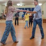 Sequim Gazette photo by Emily Matthiessen/ Sequim Ballroom students Saria Weller and Philip Wade practice Swing dancing at the Old Dungeness Schoolhouse on Thursday night.