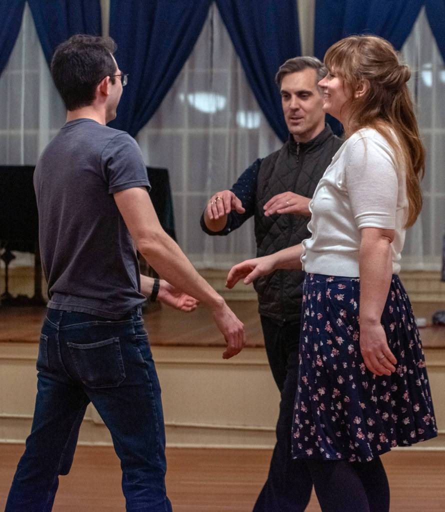 Sequim Gazette photo by Emily Matthiessen/ Ballroom dance instructor Werner Figar, center, helps dancers Dean Hennen and Desirae Cortez with their Salsa form during a recent intermediate/advanced class at Sequim Ballroom.