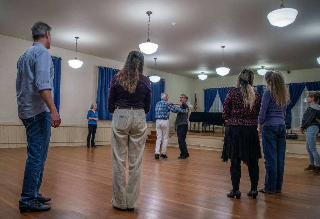 Sequim Gazette photo by Emily Matthiessen/ Sequim Ballroom students watch as instructor Werner Figar explains the finer points of a waltz.