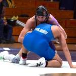 Sequim Gazette photo by Emily Matthiessen
Sequims Jayms Vilona controls his Olympic opponent on the way to a 19-3 technical fall victory in the Wolves dual-meet victory over the Trojans.