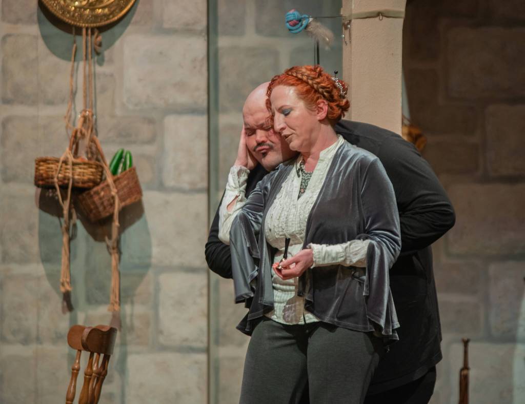 Sequim Gazette photo by Emily Matthiessen
Susan Cates as the evil stepmother Lady Tremayne strokes her cat Lucifur, played by Mario Arruda, in OTAs upcoming Panto, Cinderella and the Enabling Habit.