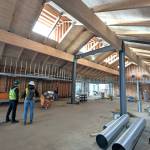 Photo courtesy NOLS
At a recent site visit, North Olympic Library System Facilities Manager Brian Phillips and SHKS Architect Pia Westen examine construction progress at the Sequim Library as its being renovated and expanded in January. NOLS leaders anticipate reopening the facility in June.