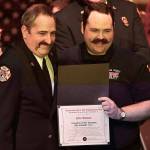 Deputy Fire Chief Tony Hudson with Clallam County Fire District 3 celebrates with his son Jake his graduation from the Clallam County Regional Fire Academy on Feb. 1.