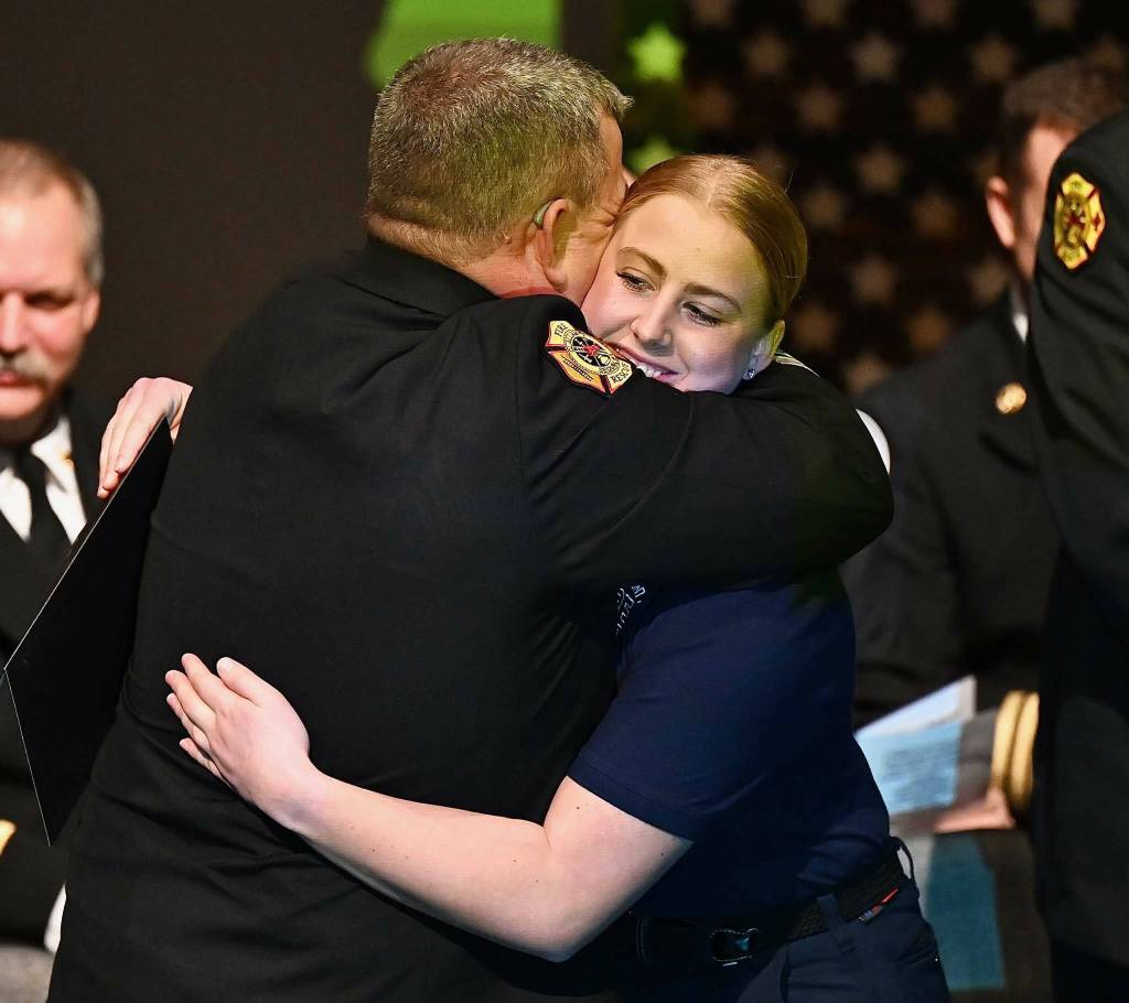 Photo courtesy Jay Cline/ Capt. Bryan Swanberg hugs his daughter Libby after she graduates from the Clallam County Regional Fire Academy on Feb. 1.