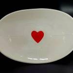The Feb. 7 First Friday Art Walk features art with a heart and red color themes. Shown here is a platter made by ceramic artist Janet Piccola. Look for her work at Blue Whole Gallery, 129 W. Washington St.
