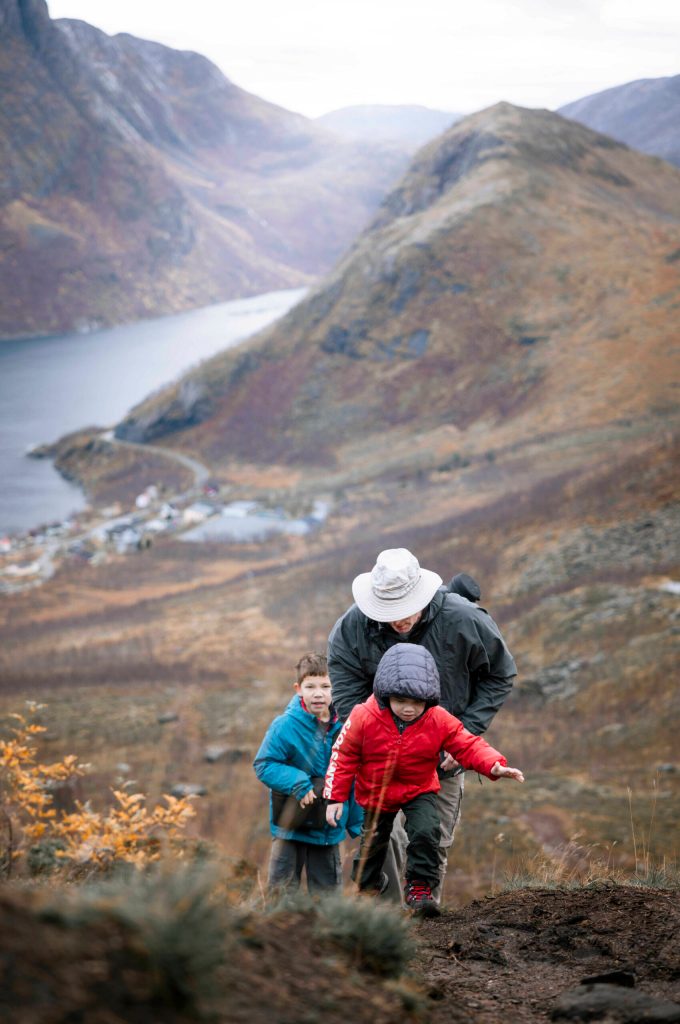 Photo by Belinda Shi/ Family members of Belinda Shi hike up a slope on the Segla/ Hesten hike in Norway.