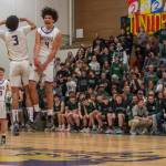 Sequim Gazette photos by Emily Matthiessen
Sequims Jericho Julmist, right, and Solomon Sheppard celebrate the Wolves come-from-behind victory over rival Port Angeles on Jan. 31.