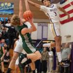 Sequim Gazette photo by Emily Matthiessen/ Solomon Sheppard goes up for a high-rising block against a shot against Port Angeles on Jan. 31.