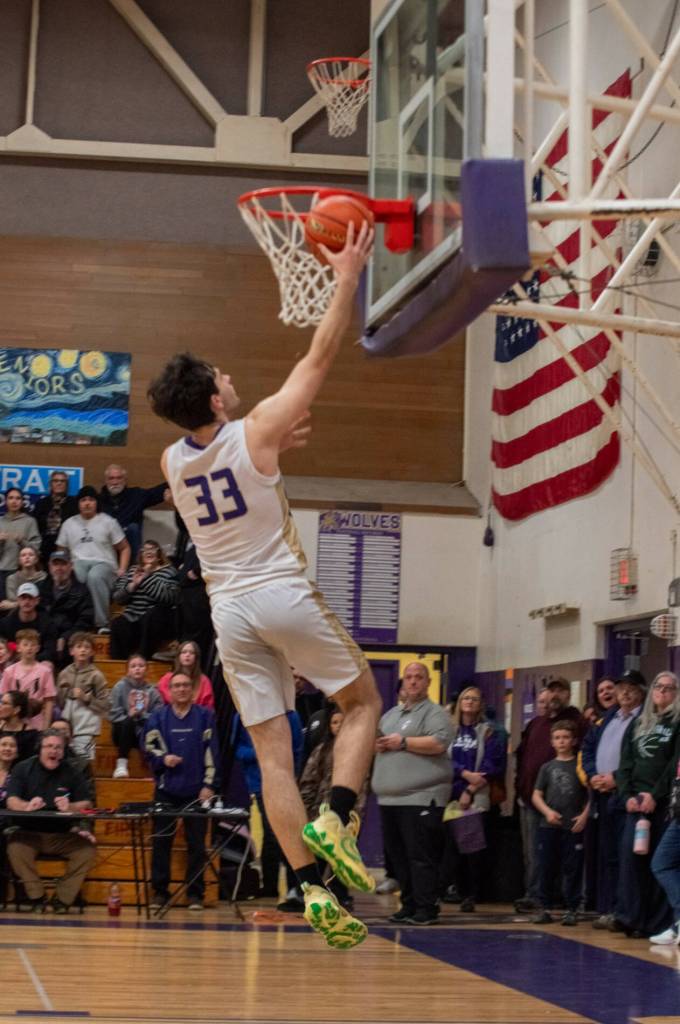 Sequim Gazette photo by Emily Matthiessen/ Jamison Gray goes up for two of his game-high 15 points against Port Angeles. He spoke to his coach Craig Brooks earlier in the week telling him he could do more for the team.