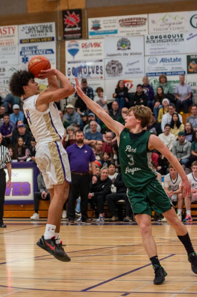 Sequim Gazette photo by Emily Matthiessen/ Jericho Julmist takes a jumper against the Roughriders in a 58-49 win over Port Angeles.