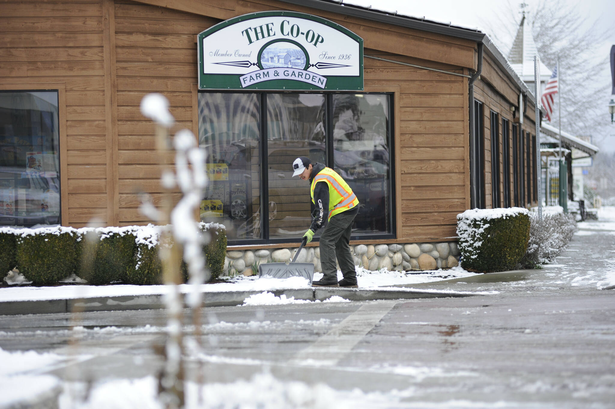 Sequim Gazette photo by Matthew Nash
Sebastian Barragan, a maintenance worker for the City of Sequim, clears the sidewalk by the Co-Op Farm and Garden on Feb. 6. Ive been expecting (the snow) awhile, he said. See story on A6
