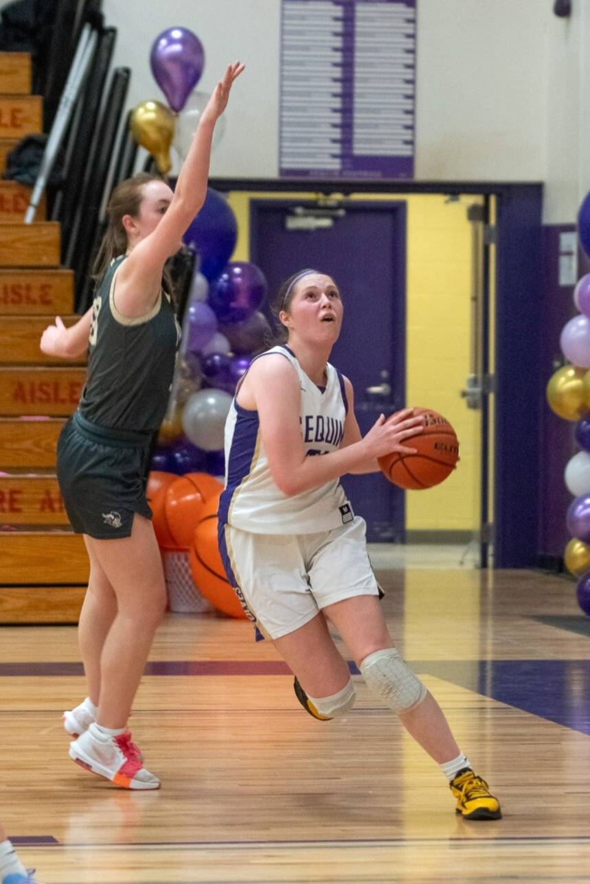 Sequim Gazette photo by Emily Matthiessen/ Libby Turella drives for a layup against North Kitsap on Feb. 7. It was the Wolves last home game of the season.