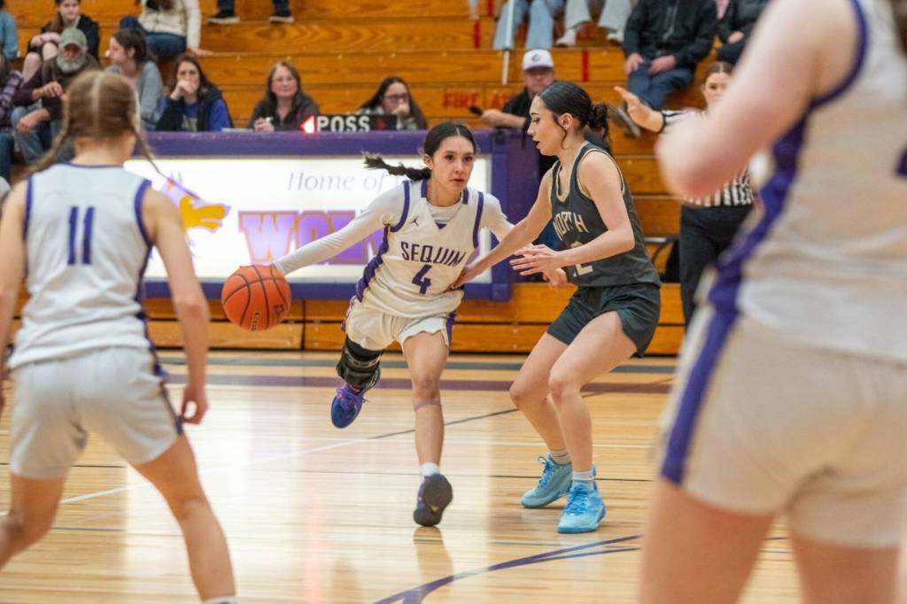 Sequim Gazette photo by Emily Matthiessen/ Gracie Chartraw looks for teammates during a play against North Kitsap on Feb. 7.