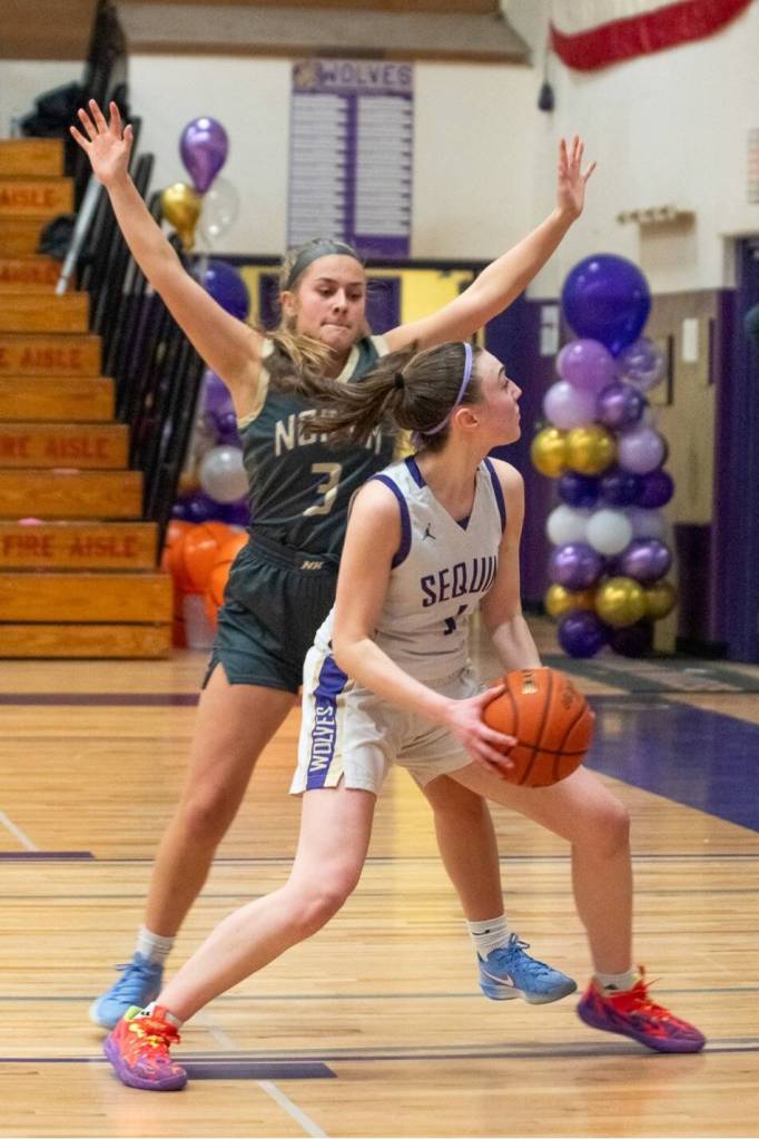 Sequim Gazette photo by Emily Matthiessen/ Taylor Heyting looks to take a shot against a North Kitsap defender.