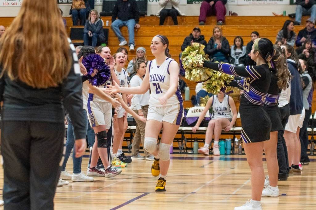 Sequim Gazette photo by Emily Matthiessen/ Senior Libby Turella is introduced on Feb. 7 during her last home game for the Sequim Wolves basketball team.