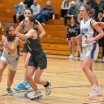 Sequim Gazette photo by Emily Matthiessen/ Manuela Valle Jover drives past North Kitsap defenders in Feb. 7 matchup.